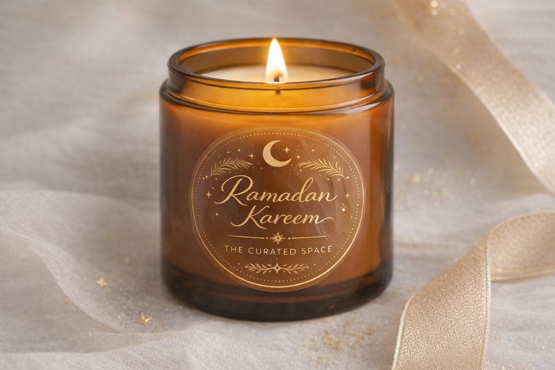Amber glass candle with a gold Ramadan Kareem label from The Curated Space